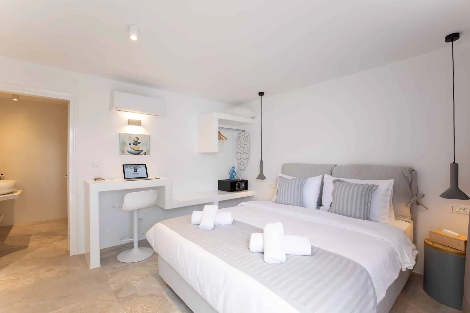Room with desk, bed and pendant lamps